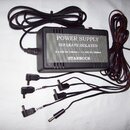 Černý napájecí adaptér s kovovým předním panelem a nápisem POWER SUPPLY SEPARATE ISOLATED, 4 x 10V DC 100mA + 2 x 10V DC/300mA STARBUCK. K adaptéru p…