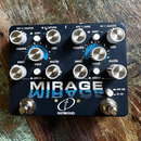 Kytarový efekt pedál černé barvy s nápisem MIRAGE a logem crazy tube circuits. Zařízení má osm stříbrných otočných ovladačů a dvě bílá tlačítka s náp…