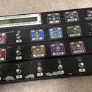 Černý MIDI pedál s nápisem FRACTAL AUDIO SYSTEMS a označením MFC-101 MIDI FOOT CONTROLLER. Zařízení obsahuje řadu spínačů s popisky jako PAN/TREM, DE…
