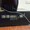 Černý kovový přístroj s digitálním displejem zobrazujícím čtyři časy 8.8.8.8. Na předním panelu jsou tlačítka s nápisy MODE/ENTER, DOWN, UP a EXIT, t…