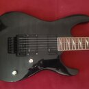 Černá elektrická kytara s tmavým dřevěným hmatníkem a dvěma humbuckery. Na hmatníku jsou vidět trojúhelníkové vložky a nápis "M-10CPN". Tělo kytary m…
