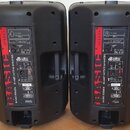 Dva černé aktivní reproduktory z plastu s viditelným zadním panelem. Na boku každého je červený nápis BASIC 200 a text BASIC SERIES BI-AMP ACTIVE SPE…