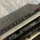 Černý kytarový zesilovač s nápisem TUBE POWERAMP 810 a logem ENGL. Přední panel obsahuje řadu otočných potenciometrů, přepínačů a červených kontrolní…