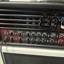 Černý kytarový zesilovač s chromovaným logem ENGL na přední mřížce. Přední panel obsahuje řadu ovládacích knoflíků a červených kontrolních světelek s…