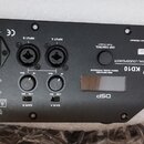 Zadní panel černého elektronického zařízení s nápisy nova KD10 a DSP. Panel obsahuje dva vstupy INPUT A a INPUT B s konektory XLR, dva ovratidla pro…