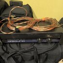 Černý výkonový zesilovač s nápisem Professional Power Amplifier QSA 260 a logem QSOUND. Přední panel obsahuje dva ovratidla pro CHANNEL 1 a CHANNEL 2…