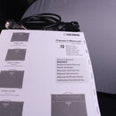 Fotografie zachycuje uživatelský manuál s nápisem Owner's Manual a logem BOSS. Na stránce jsou vyobrazeny různé modely zesilovačů s popisky KATANA-50…