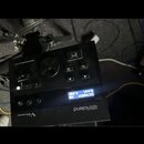 Černý elektronický bicí modul značky Roland s nápisem V-Drums. Na horní části jsou ovládací knofíky, tlačítka a nápisy DRUM SOUND MODULE TD-11, EXIT…