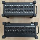 Dvě černé rackové jednotky značky ALLEN&HEATH, model DX168 AudioRack. Zařízení mají na předním panelu řady vstupů a výstupů typu XLR s označením INPU…