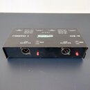 Černá DI-box s nápisem DI-BOX a 2 CHANNELS. Na horní straně jsou přepínače s označením INPUT, OFF -30 ON a OFF -10 OFF, dále nápisy CE S 02 a SOUND &…