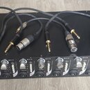 Černý rackový přístroj s nápisem EP 84 a textem pod ním, který je nečitelný. Přední panel obsahuje osm kanálů s knoflíky označenými jako GAIN a PEAK,…