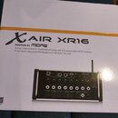 Fotografie znázorňuje bílou krabici s produktovou fotografií digitálního mixeru. Na krabici je uveden nápis X AIR XR16 a text POWERED BY MIDAS, dále…