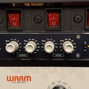 Černý rackový stereofonní ekvalizér s nápisem XFILTER CLASS-A STEREO EQUALIZER. Přístroj má čtyři stříbrné otočné ovladače s popisky Gain a Freq, dop…