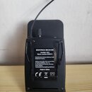 Černý bezdrátový bodypack přijímač s anténou. Na zadní straně je nalepený štítek s nápisy BODYPACK RECEIVER, Number: 023, Batch number: 250215 a Manu…