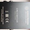 Fotografie zachycuje spodní část černého efekt pedálu. Je na ní vidět bílý nápis Darkglass Electronics a motto Your vision, our gear. Uprostřed je uv…