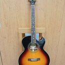 Akustická kytara s cutawayem v barevné variantě sunburst. Na hlavě hmatníku je bílý nápis Epiphone a logo v podobě křídlů. Uprostřed ozvučnice je vid…