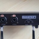 Zadní strana černého elektronického zařízení s několika konektory a ovládacími prvky. Jsou zde viditelné nápisy „DC IN (12V-18V)“, „AF IN(R)“, „AF IN…
