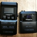 Černý bezdrátový systém značky BOSS. Na levé části je nápis WL-60 WIRELESS SYSTEM, tlačítka CABLE TONE, ENTER, SCAN a CH, dále označení OUTPUT a INPU…