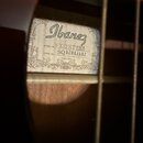 Fotografie zachycuje vnitřní štítek akustické kytary s logem Ibanez. Na štítku je uveden MODEL No. FX72NT1201 a SERIAL No. SQ 02041482, dále nápis Ma…