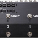 Černý efektový spínač s nápisy BOSS EFFECTS SWITCHING SYSTEM ES-8. Zařízení má digitální displej, kde je zobrazen text 00.1 Switching System j=120 a…