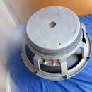 Stříbrný reproduktor s kovovým magnetem a rámem. Na zadní straně magnetu je nápis ELECTRO-VOICE, INC. EVM MODEL 12N OEM TYPE ONE YEAR (LIMITED) WARRA…