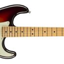 Elektrická kytara s trupem v barevném přechodu od tmavě hnědé k žluté a světle zeleným pickguardem. Na hlavě hmatníku je viditelné logo Fender. Nástr…