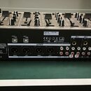 Černý mixážní pult s nápisem Power Dynamics Professional Audio a označením PDZM700 4 ZONE MIXER. Na zadním panelu je uvedena Ref. Nr.: 172.750 a práz…