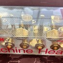 Sada ladíček v původním plastovém obalu. Kovové součástky mají zlatou barvu. Na obalu je červený nápis Machine Heads a logo GOTOH s webovou adresou w…