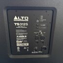 Zadní panel černého aktivního subwooferu značky ALTO PROFESSIONAL, model TS312S. Na panelu je nápis 2000-WATT 12" POWERED SUBWOOFER a několik ovládac…