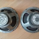 Dvě reproduktory s kovovým rámem v stříbrné barvě. Na středovém štítku obou kusů je nápis CELESTION G12S-50 a text CELESTION INTERNATIONAL LTD. FOXHA…