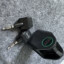 Dvě černé redukce jack konektorů. Na jedné je vidět nápis „SWIFFE AUDIO“ v zeleném kruhu a stejný nápis menším písmem na těle redukce. Druhá redukce…