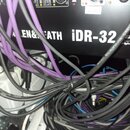 Fotografie zachycuje část černého zařízení s nápisy NETWORK, Hot Bridge a označením ALLEN&FATH iDR-32. Na panelu jsou vidět konektory, kontrolky a bí…