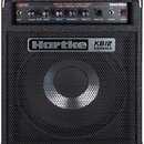 Černý basový kombozesilovač s kovovou mřížkou a chromovanými rohy. Na horním ovládacím panelu jsou nápisy KB12, 500W BASS AMPLIFIER, HYDRIVE SPEAKER…