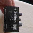 Černý efekt pedál s nápisem DigiTech. Na horní straně jsou popisky VOLUME a 9VDC 500mA, dále text Manufactured under US Patent Number: US 8,507,781 B…