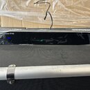 Černý ladicí pedál s nápisy ROCKBOARD by MARWICK a StageTuner ST-02. Na předním panelu jsou vidět tlačítka s popisky OUT, MODE a CAL, vprostřed svítí…