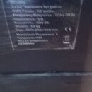Detailní záběr na černý povrch s nalepeným technickým štítkem. Na štítku je uveden text: G112 Vintage, 1x12" Speakers for guitar, RMS Power: 60 watts…