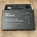 Černá krabice s nápisy „the Ut.bone“, „Ovid System CC100 Clip Condenser Microphone“ a doplňujícími texty o profesionálním mikrofonu pro hudební nástr…