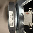 Fotografie zachycuje zadní část reproduktoru s kovovým rámem a bílou štítkem. Na štítku je uveden nápis CELESTION, model G12T-100, kód T5156A, impeda…