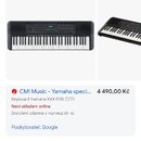 Snímek zachycuje digitální keyboard černé barvy. Na přístroji je viditelné logo YAMAHA. V textu nad a pod obrázkem je uveden název modelu Yamaha PSR-…