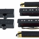 Sada černých snímačů pro kytaru. Obsahuje dva kryté humbuckery, dva otevřené humbuckery s viditelnými póly a dva úzké jednoduché snímače na žlutém po…