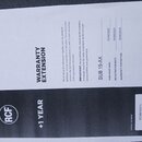 Fotografie zobrazuje dokument s nápisem WARRANTY EXTENSION a logem RCF. Dokument obsahuje text v angličtině, označení modelu SUB 15-AX a data: PURCHA…