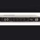 Rackslový předzesilovač s černým čelem a stříbrným šasi. Na čele je nápis INTERSTELLAR OVERDRIVE Preamp a logo Warhead v kruhu. Zařízení obsahuje něk…