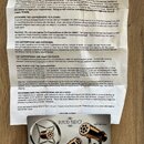 Fotografie zachycuje papírový návod k použití s nápisem PLACID AUDIO v horní části. Text je rozdělen do několika sekcí, včetně informací o záruce a p…