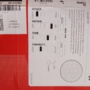 Fotografie znázorňuje zadní stranu obalu od bubnového koženu. Je zde uveden název G1 COATED TOM BATTER, značka EVANS a rozměr 14". Na obalu jsou graf…