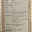 Fotografie dokumentu s detaily o hudebním nástroji. Text uvádí Brand: FENDER, Model: PRECISION BASS, Country of Origin: U.S.A., Year: 1975 a SN: 5848…