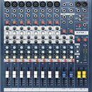 Modrý mixážní pult s bílými a šedými ovládacími prvky. V pravém horním rohu je logo Soundcraft a vpravo uprostřed nápis EPM 8. Zařízení obsahuje osm…