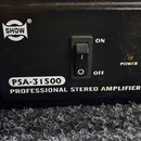 Černý stereo zesilovač s nápisem PROFESSIONAL STEREO AMPLIFIER. Na předním panelu je bílé logo SHOW v oválu a označení modelu PSA-31500. Uprostřed se…