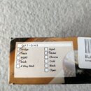 Detail štítku s nápisem OPTIONS na kartonové krabici. V levém sloupci jsou zaškrtnuté políčka Bridge, Neck a Stock, neznačená jsou RWRP a 4 Way Mod.…