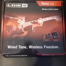 Krabice s nápisem LINE 6 a Relay G30 Wireless Guitar System. Na balení je fotografie kytary a dvou komponentů s popisky TBP06 Transmitter a RXS06 Rec…