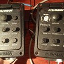 Dvě černé předzesilovače s tunerem značky FISHMAN. Levý kus nese nečitelný nápis vedle displeje a ovládací prvky volume, tuner, bass, middle, treble,…